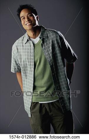 Portrait of a teenage boy smiling View Large Photo Image Stock Photograph - Portrait of a teenage boy smiling. Fotosearch