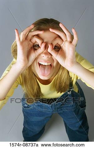 Portrait of a teenage girl making a face View Large Photo Image Stock Image - Portrait of a teenage girl making a face. Fotosearch