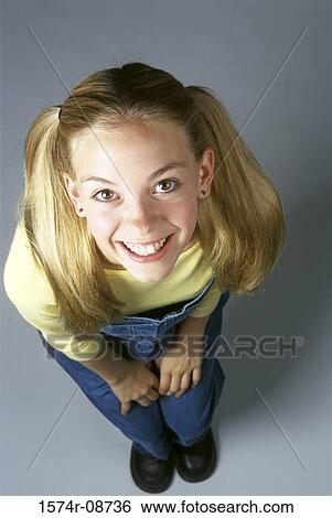 Stock Photograph - Portrait of a teenage girl smiling. Fotosearch