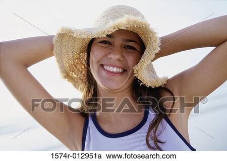 Portrait of a teenage girl wearing a hat View Large Photo Image Stock Image - Portrait of a teenage girl wearing a hat. Fotosearch