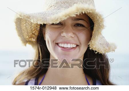 Portrait of a teenage girl wearing a hat View Large Photo Image Stock Photo - Portrait of a teenage girl wearing a hat. Fotosearch