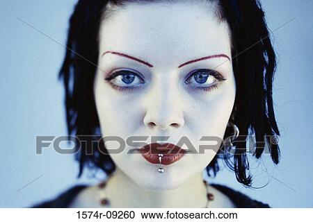 Stock Image - Portrait of a teenage girl wearing make-up. Fotosearch