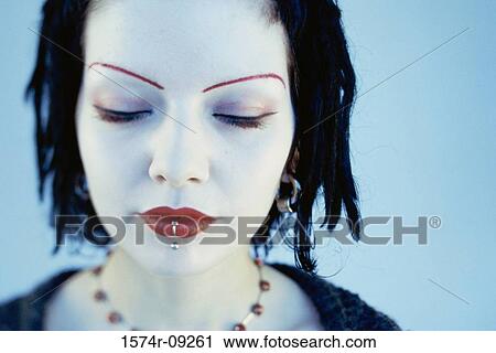 Portrait of a teenage girl wearing make-up View Large Photo Image Stock Image - Portrait of a teenage girl wearing make-up. Fotosearch