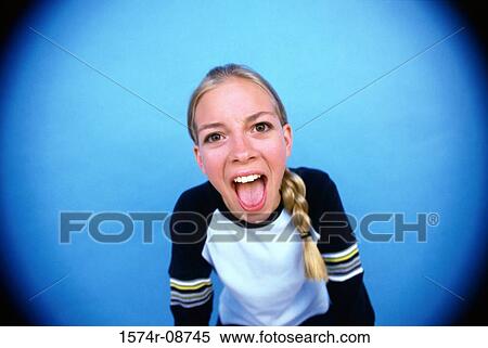 Portrait of a teenage girl with her mouth wide open View Large Photo Image Stock Photography - Portrait of a teenage girl with her mouth wide open. Fotosearch