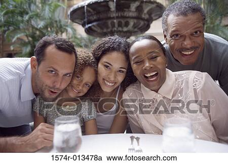 Portrait of a three generation family smiling View Large Photo Image Stock Image - Portrait of a three generation family smiling. Fotosearch