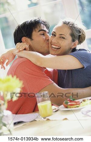 Portrait of a young couple at a breakfast table View Large Photo Image Stock Image - Portrait of a young couple at a breakfast table. Fotosearch