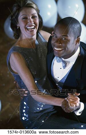 Portrait of a young couple dancing and smiling View Large Photo Image Stock Image - Portrait of a young couple dancing and smiling. Fotosearch