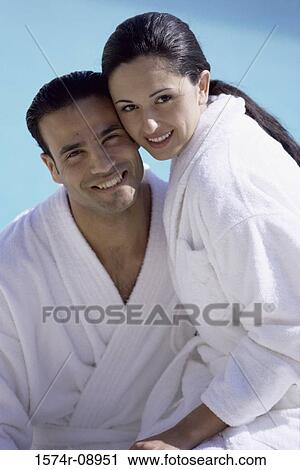 Portrait of a young couple wearing bathrobes View Large Photo Image Stock Image - Portrait of a young couple wearing bathrobes. Fotosearch