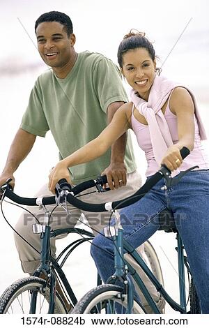 Portrait of a young couple with bicycles at the beach View Large Photo Image Stock Image - Portrait of a young couple with bicycles at the beach. Fotosearch