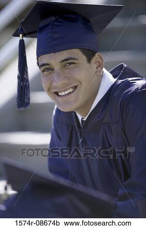 Portrait of a young male graduate smiling View Large Photo Image Stock Image - Portrait of a young male graduate smiling. Fotosearch