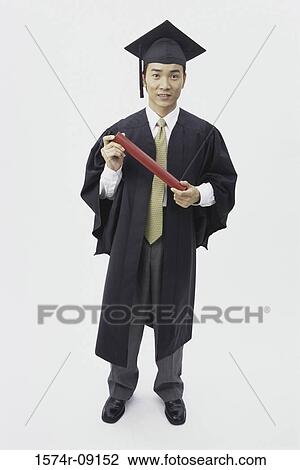 Portrait of a young male graduate holding a diploma View Large Photo Image Stock Image - Portrait of a young male graduate holding a diploma. Fotosearch
