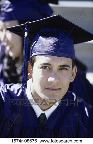 Portrait of a young male graduate smiling View Large Photo Image Stock Photograph - Portrait of a young male graduate smiling. Fotosearch