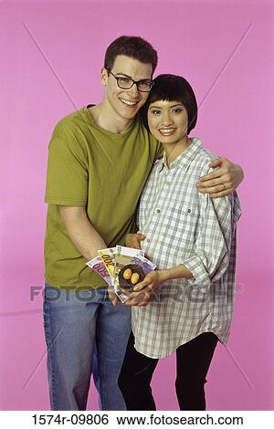 Portrait of a young man holding a pregnant young woman View Large Photo Image Stock Photograph - Portrait of a young man holding a pregnant young woman. Fotosearch