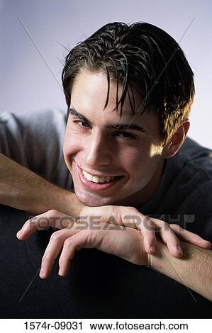 Stock Image - Portrait of a young man smiling. Fotosearch