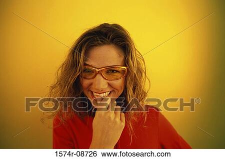 Portrait of a young woman smiling View Large Photo Image Stock Photograph - Portrait of a young woman smiling. Fotosearch