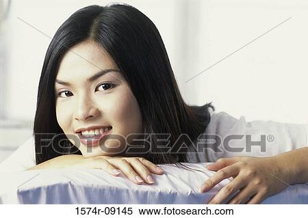 Portrait of a young woman smiling View Large Photo Image Stock Photography - Portrait of a young woman smiling. Fotosearch