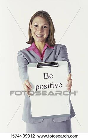 Portrait of businesswoman holding a clipboard smiling View Large Photo Image Stock Image - Portrait of businesswoman holding a clipboard smiling. Fotosearch
