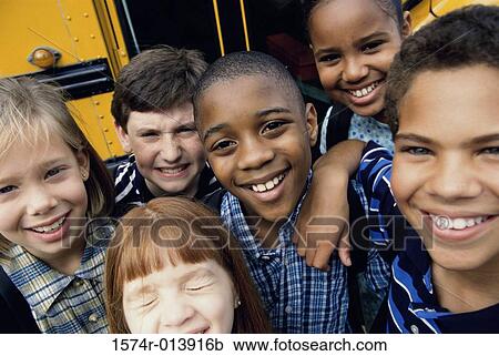Portrait of children near a school bus View Large Photo Image Stock Image - Portrait of children near a school bus. Fotosearch