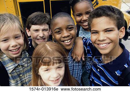 Portrait of children near a school bus View Large Photo Image Stock Image - Portrait of children near a school bus. Fotosearch