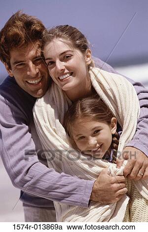 Portrait of parents and their daughter standing on the beach View Large Photo Image Stock Image - Portrait of parents and their daughter standing on the beach. Fotosearch
