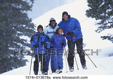 Portrait of parents skiing with their son and daughter View Large Photo Image Stock Image - Portrait of parents skiing with their son and daughter. Fotosearch