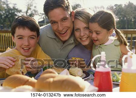 Stock Image - Portrait of parents with their son and daughter. Fotosearch