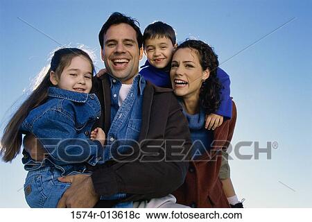 Portrait of parents with their son and daughter View Large Photo Image Stock Image - Portrait of parents with their son and daughter. Fotosearch