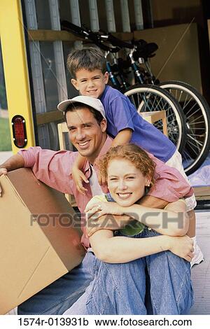 Portrait of parents with their son in their new home View Large Photo Image Stock Image - Portrait of parents with their son in their new home. Fotosearch