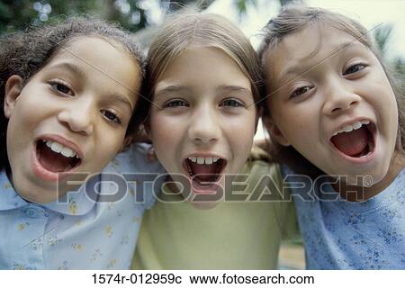 Portrait of three girls shouting View Large Photo Image Stock Image - Portrait of three girls shouting. Fotosearch