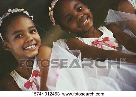 Portrait of two ballet dancers smiling View Large Photo Image Stock Image - Portrait of two ballet dancers smiling. Fotosearch