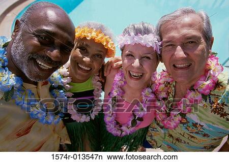 Picture - Portrait of two senior couples smiling. Fotosearch