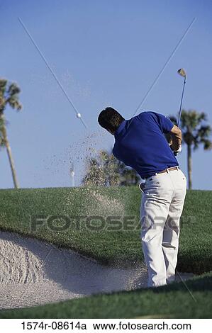 Rear view of a man playing golf View Large Photo Image Stock Image - Rear view of a man playing golf. Fotosearch