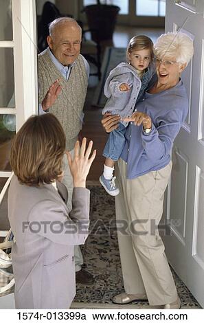 Rear view of a mother waving to her daughter and parents View Large Photo Image Stock Image - Rear view of a mother waving to her daughter and parents. Fotosearch