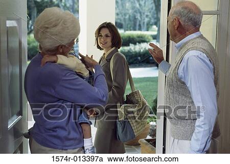 Rear view of parents waving to their daughter View Large Photo Image Stock Image - Rear view of parents waving to their daughter. Fotosearch