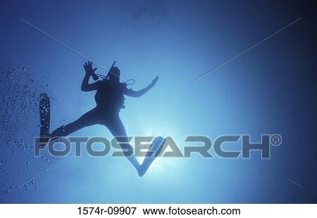 Scuba diver swimming underwater View Large Photo Image Stock Photo - Scuba diver swimming underwater. Fotosearch