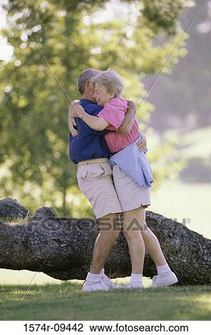 Senior couple hugging each other View Large Photo Image Stock Image - Senior couple hugging each other. Fotosearch