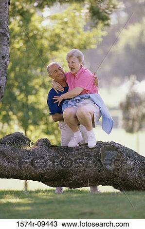 Senior couple playing in the park View Large Photo Image Stock Image - Senior couple playing in the park. Fotosearch