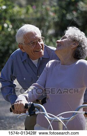 Senior couple riding a tandem bicycle View Large Photo Image Stock Image - Senior couple riding a tandem bicycle. Fotosearch