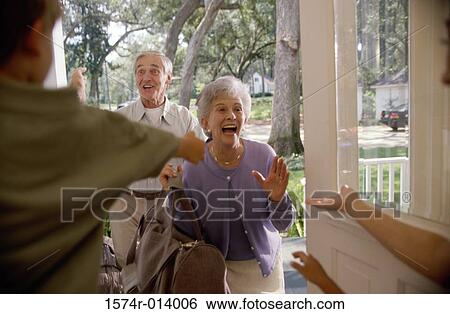 Senior couple standing at the front door View Large Photo Image Stock Photograph - Senior couple standing at the front door. Fotosearch