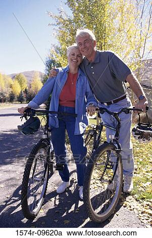 Senior couple with bicycles View Large Photo Image Stock Image - Senior couple with bicycles. Fotosearch