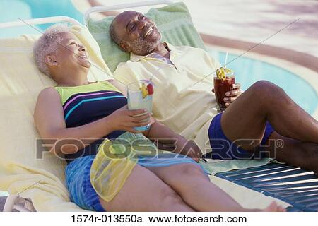 Senior man cheering a senior woman on a miniature golf course View Large Photo Image Stock Image - Senior man cheering a senior woman on a miniature golf course. Fotosearch