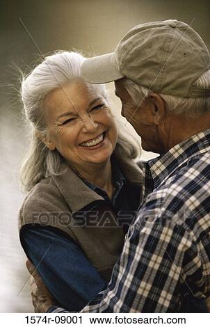 Senior man hugging a senior woman View Large Photo Image Stock Image - Senior man hugging a senior woman. Fotosearch