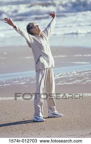 Senior woman exercising on the beach View Large Photo Image Stock Image - Senior woman exercising on the beach. Fotosearch