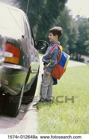 Side profile of a boy looking at a stranger in a car View Large Photo Image Stock Image - Side profile of a boy looking at a stranger in a car. Fotosearch