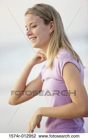 Side profile of a teenage girl smiling View Large Photo Image Stock Image - Side profile of a teenage girl smiling. Fotosearch