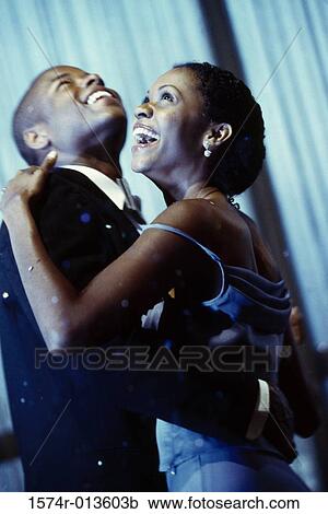 Side profile of a young couple dancing View Large Photo Image Stock Image - Side profile of a young couple dancing. Fotosearch