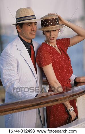 Side profile of a young couple standing on the deck of a cruise ship View Large Photo Image Stock Image - Side profile of a young couple standing on the deck of a cruise ship. Fotosearch