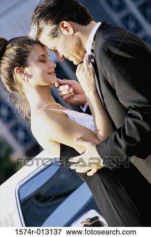 Side profile of a young couple standing face to face View Large Photo Image Stock Photo - Side profile of a young couple standing face to face. Fotosearch
