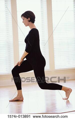 Side profile of a young pregnant woman exercising View Large Photo Image Stock Image - Side profile of a young pregnant woman exercising. Fotosearch