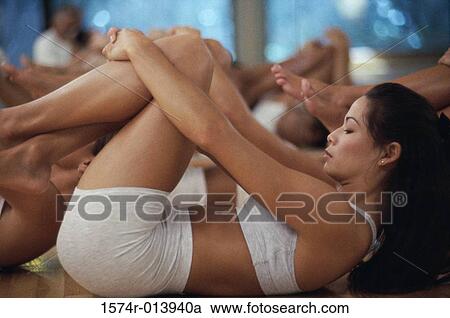 Side profile of a young woman exercising View Large Photo Image Stock Image - Side profile of a young woman exercising. Fotosearch